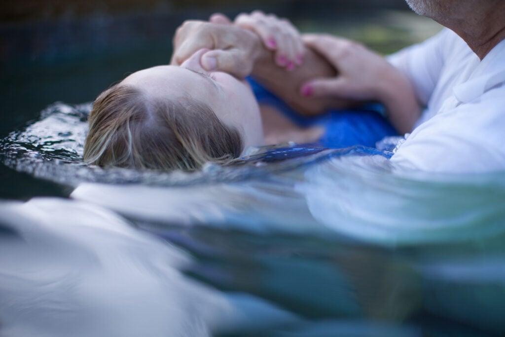 Woman being baptized