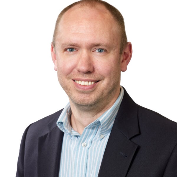 Headshot of a smiling man