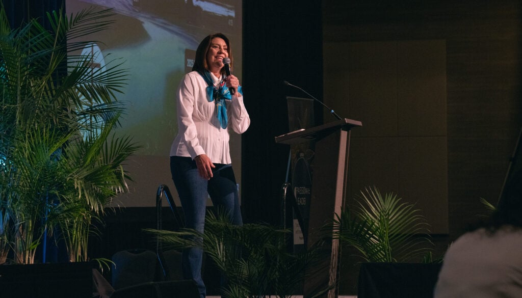 Woman on stage smiling