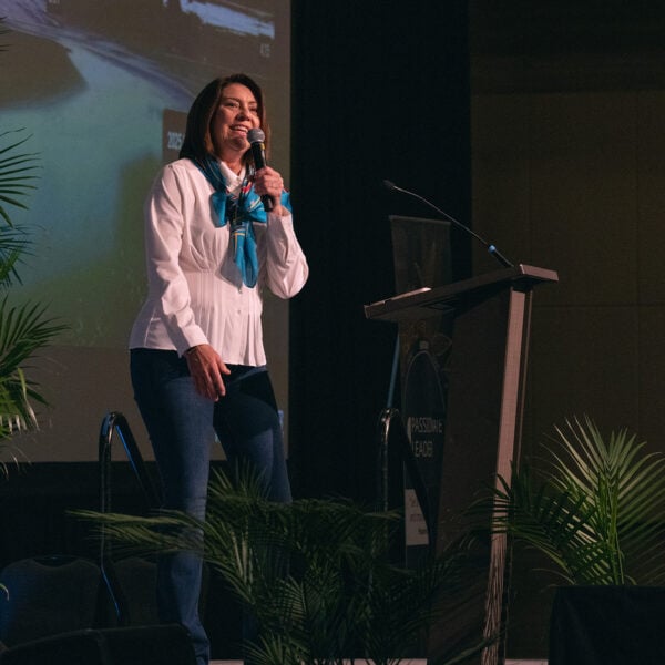 Woman on stage smiling