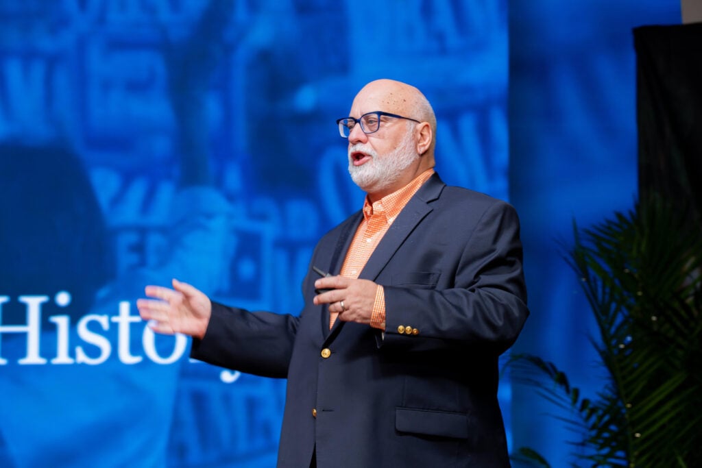 Closeup of a man giving a keynote speech.