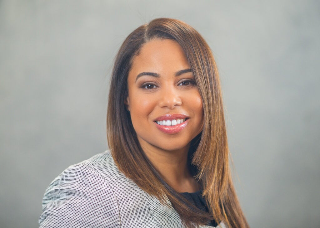 Headshot of a woman in a suit. 
