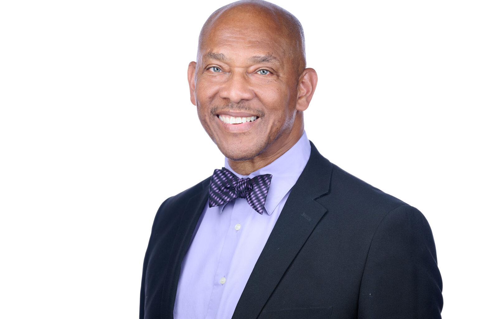 Headshot of a man in a suit