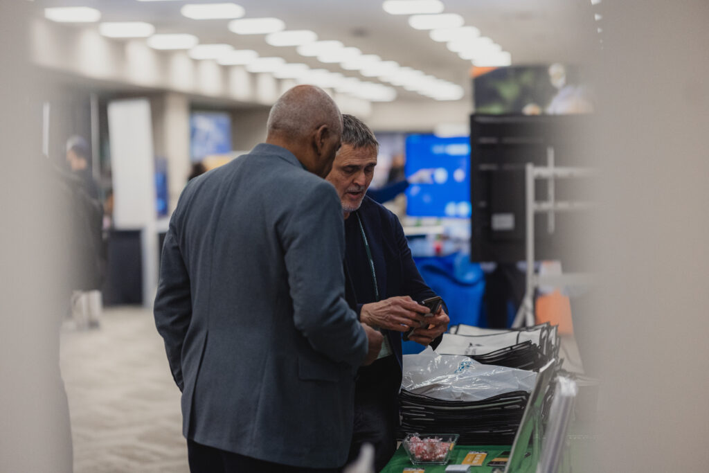 Two males engage in conversation.
