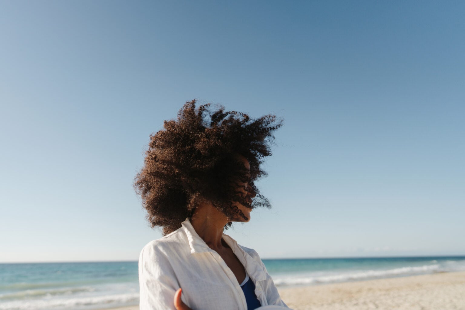 Portrait of a beautiful, smiling African American woman on the beach