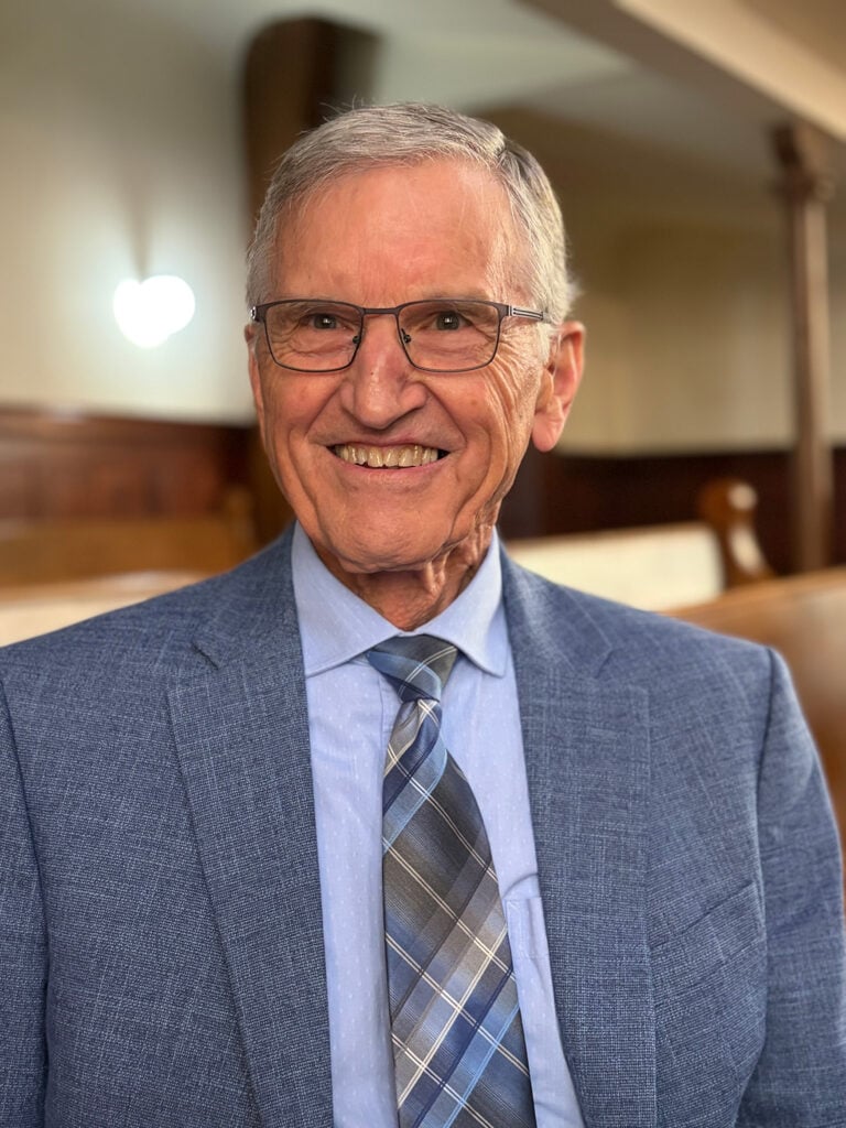Headshot of a smiling older man