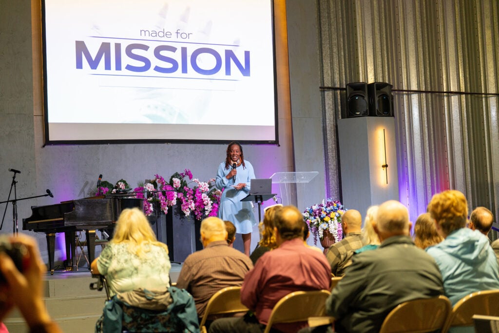 Orna Garnett speaks at camp meeting