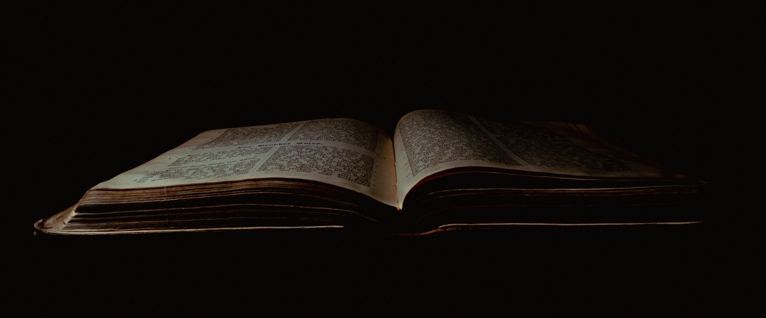 an open book sitting on top of a table