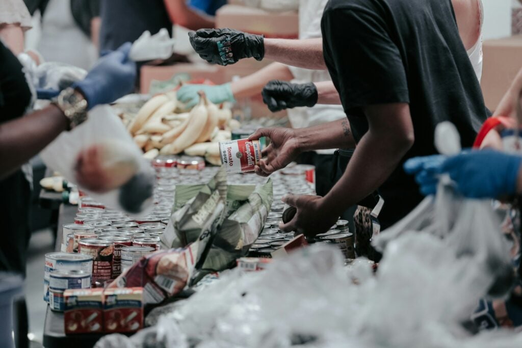 Volunteers sorting food donations for community outreach.