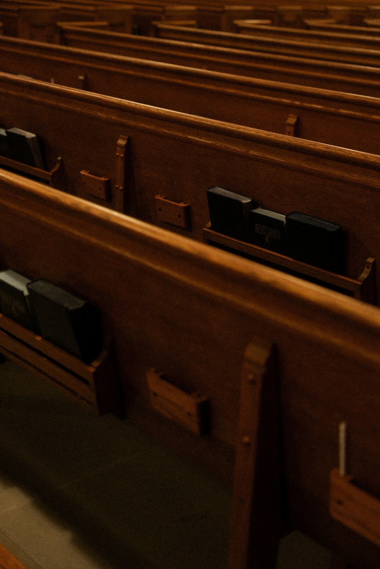 A row of wooden pews in a church