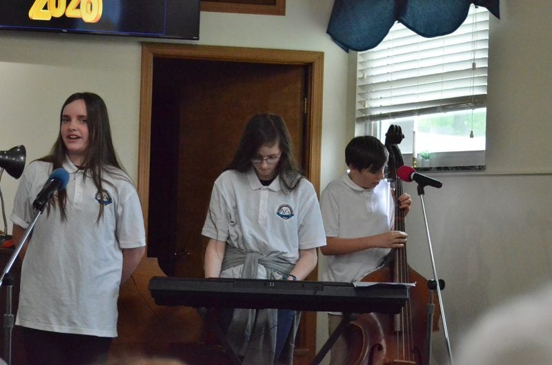 Students and teachers making music in worship