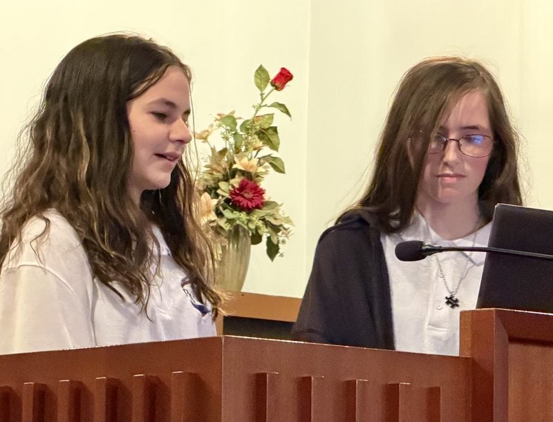 Students speaking to the congregation