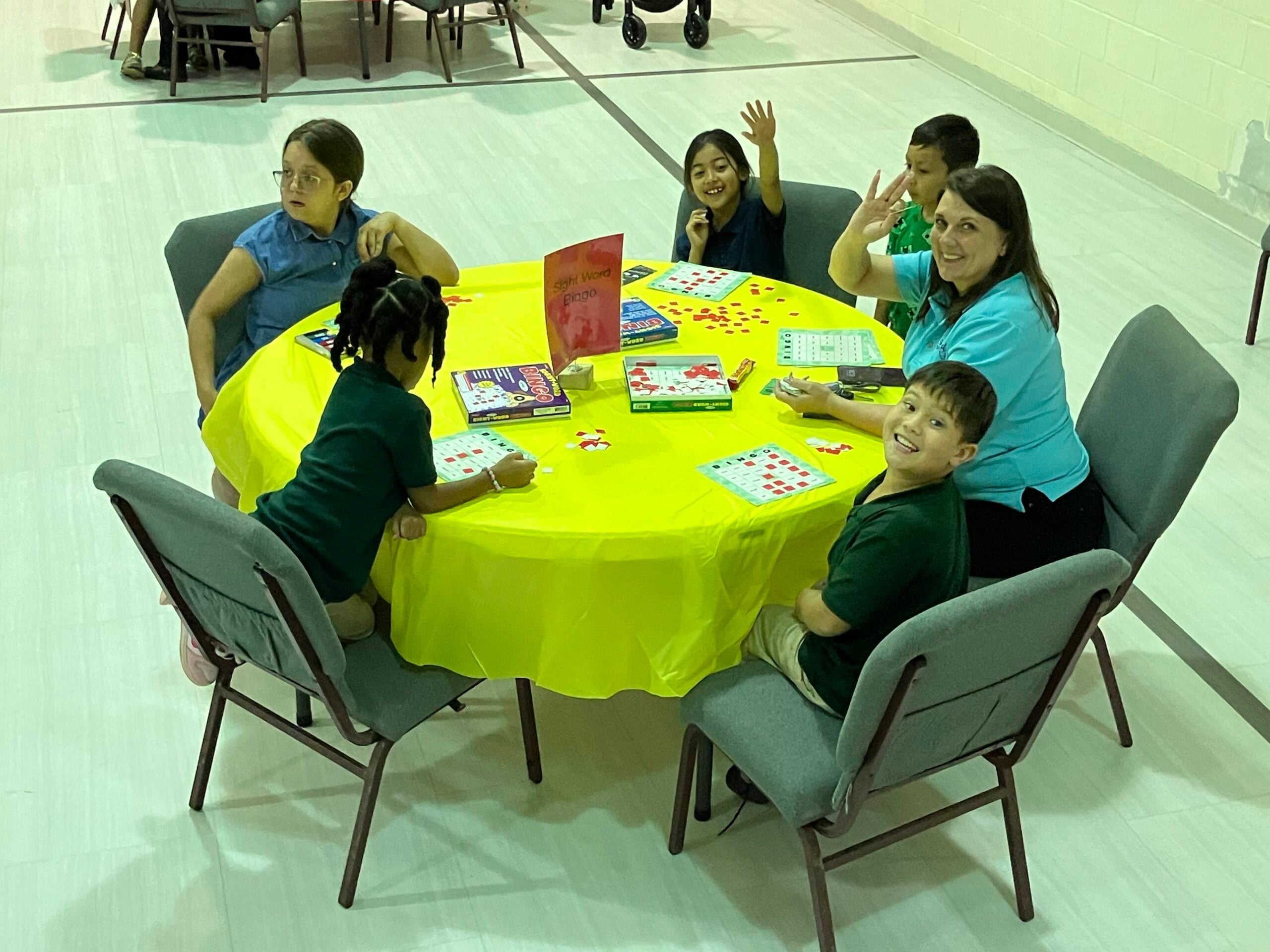 Family Night table with parent and students playing a game