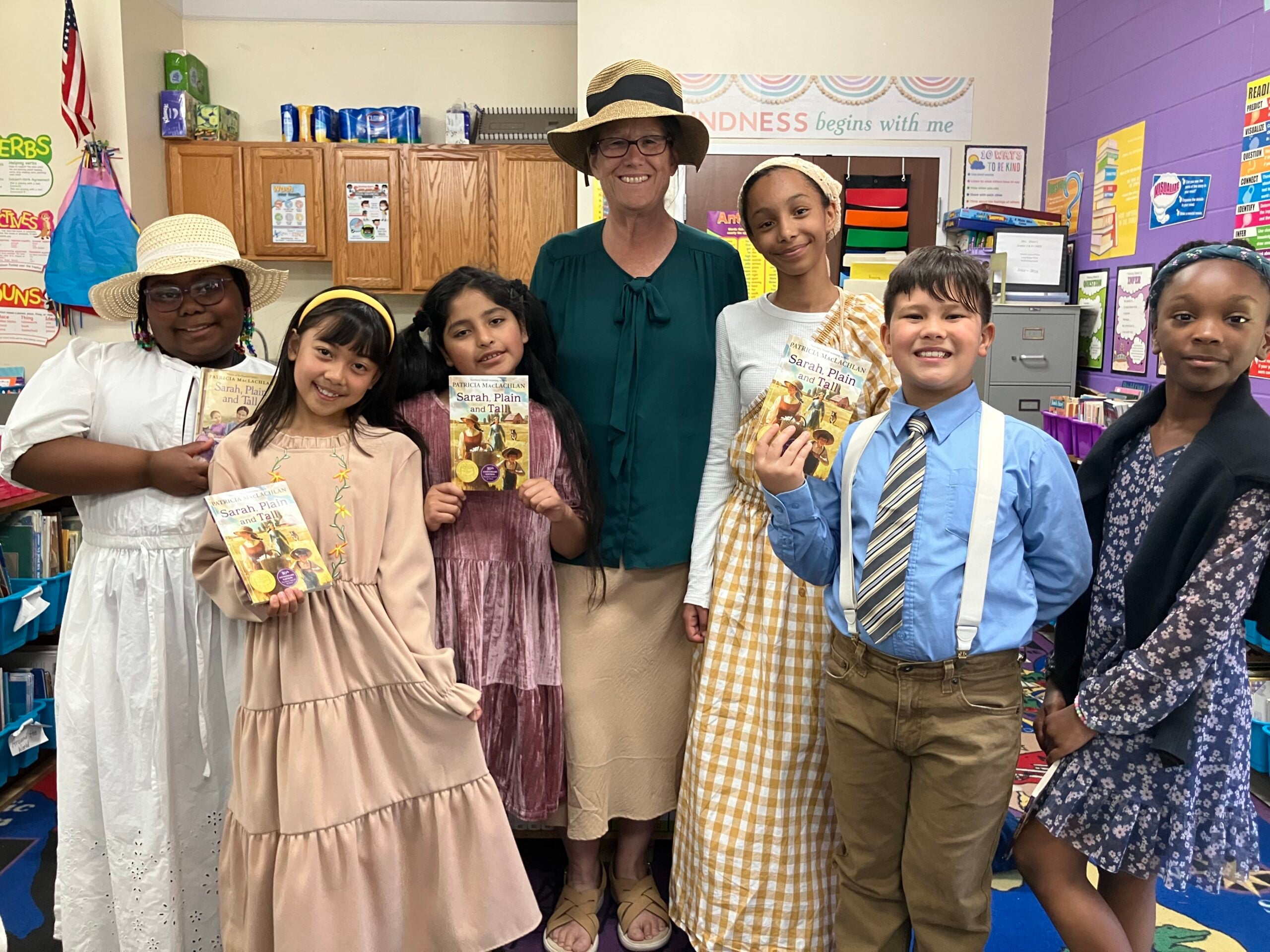 Children and teacher at a reading celebration