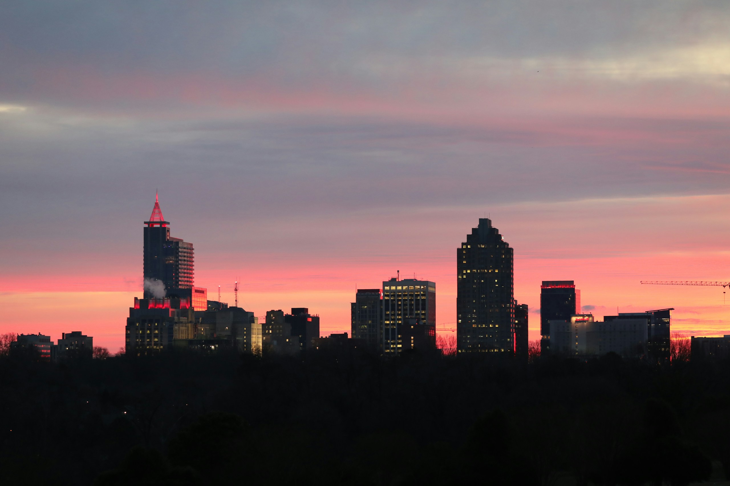 a view of a city skyline at sunset