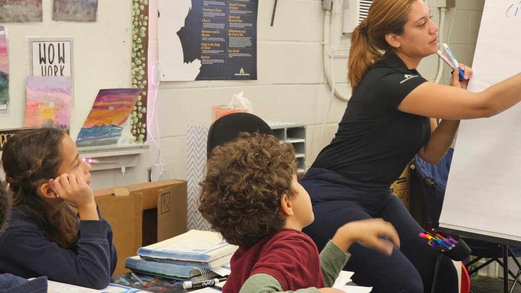 Reading Junior Academy students participating in a small-group classroom lesson