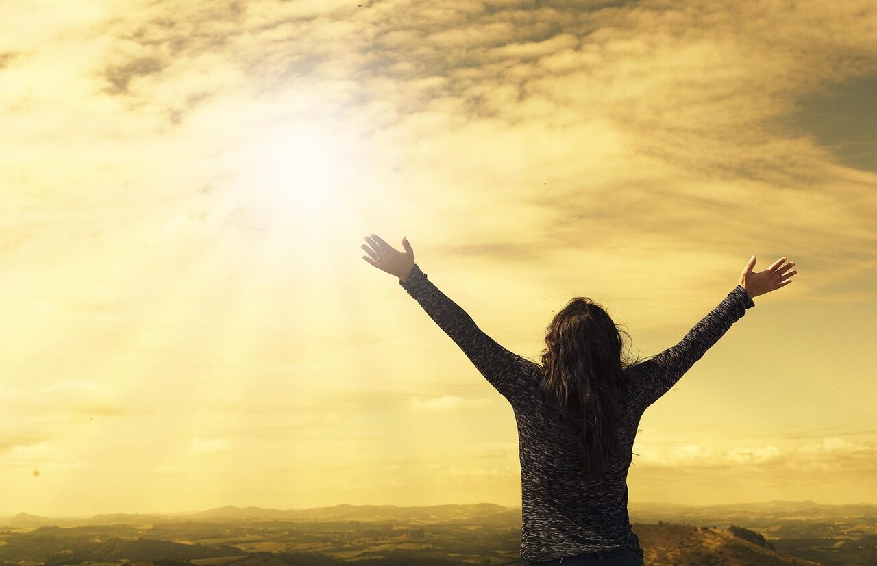 woman, sky, sunlight, arms, nature, open arms, sunbeams, sunrays, clouds, worship, freedom, happiness, relieved, prayer, praise, success, joy