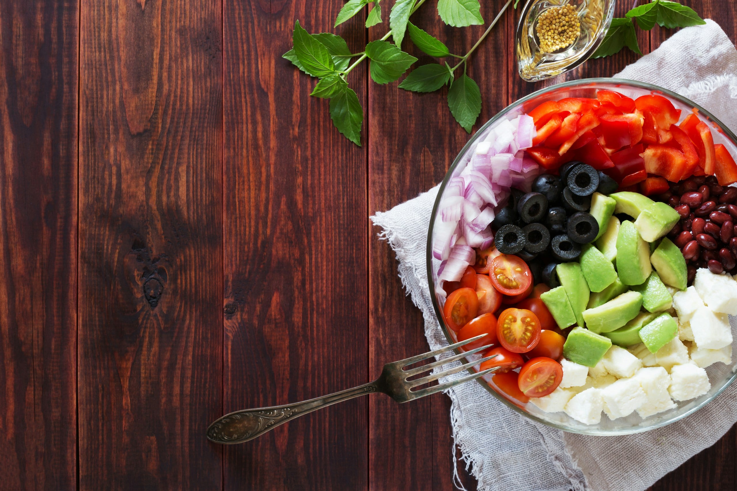 A colorful salad bowl with many fresh ingredients.