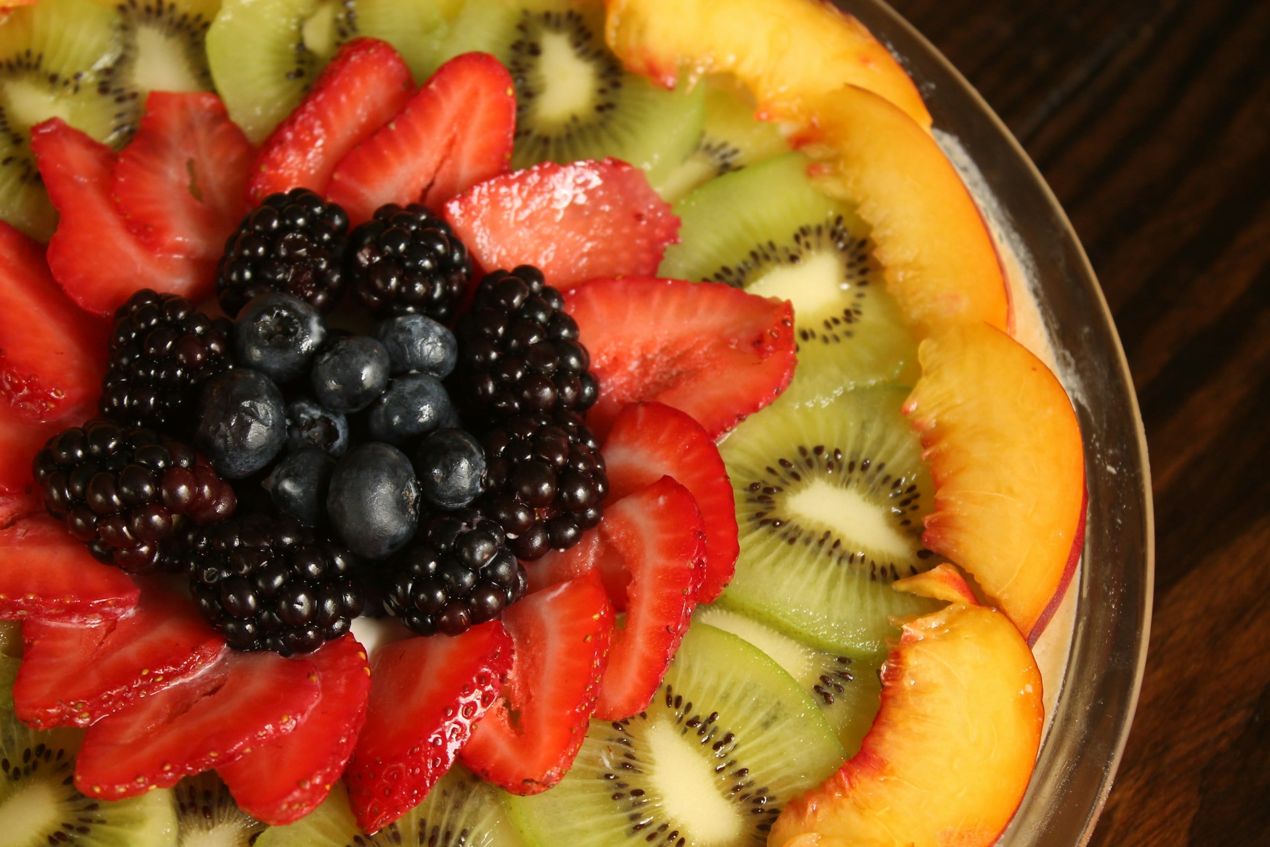 a close up of a plate of fruit on a table