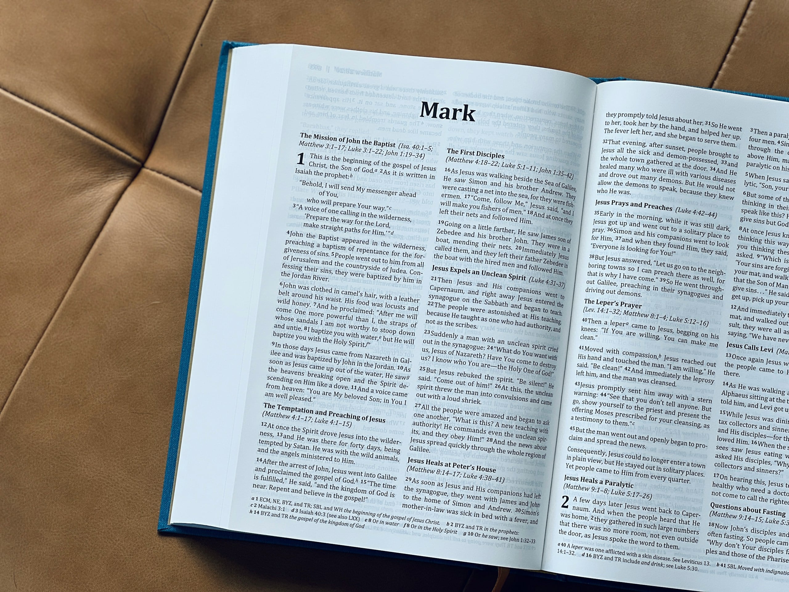 Open bible with the gospel of mark is visible.
