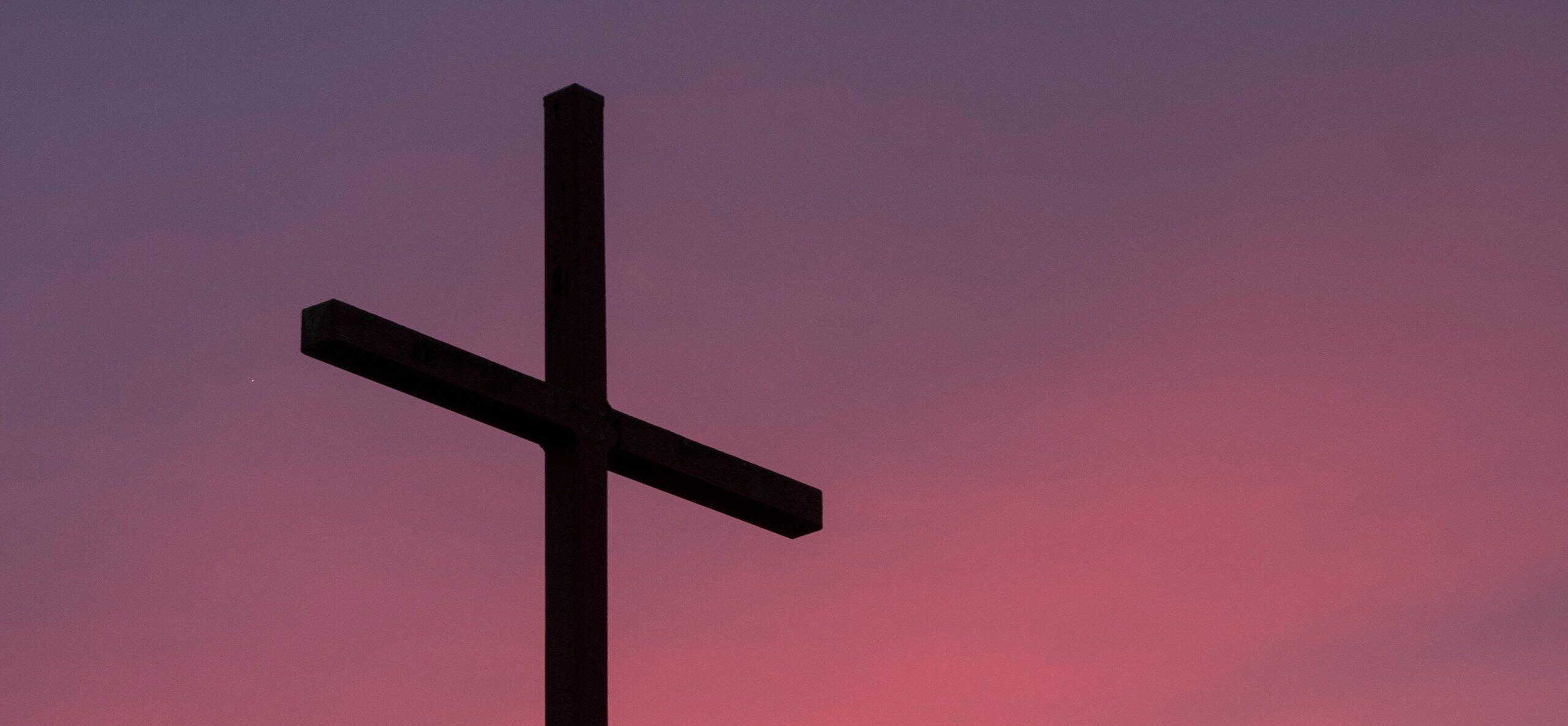 brown wooden cross during golden hour