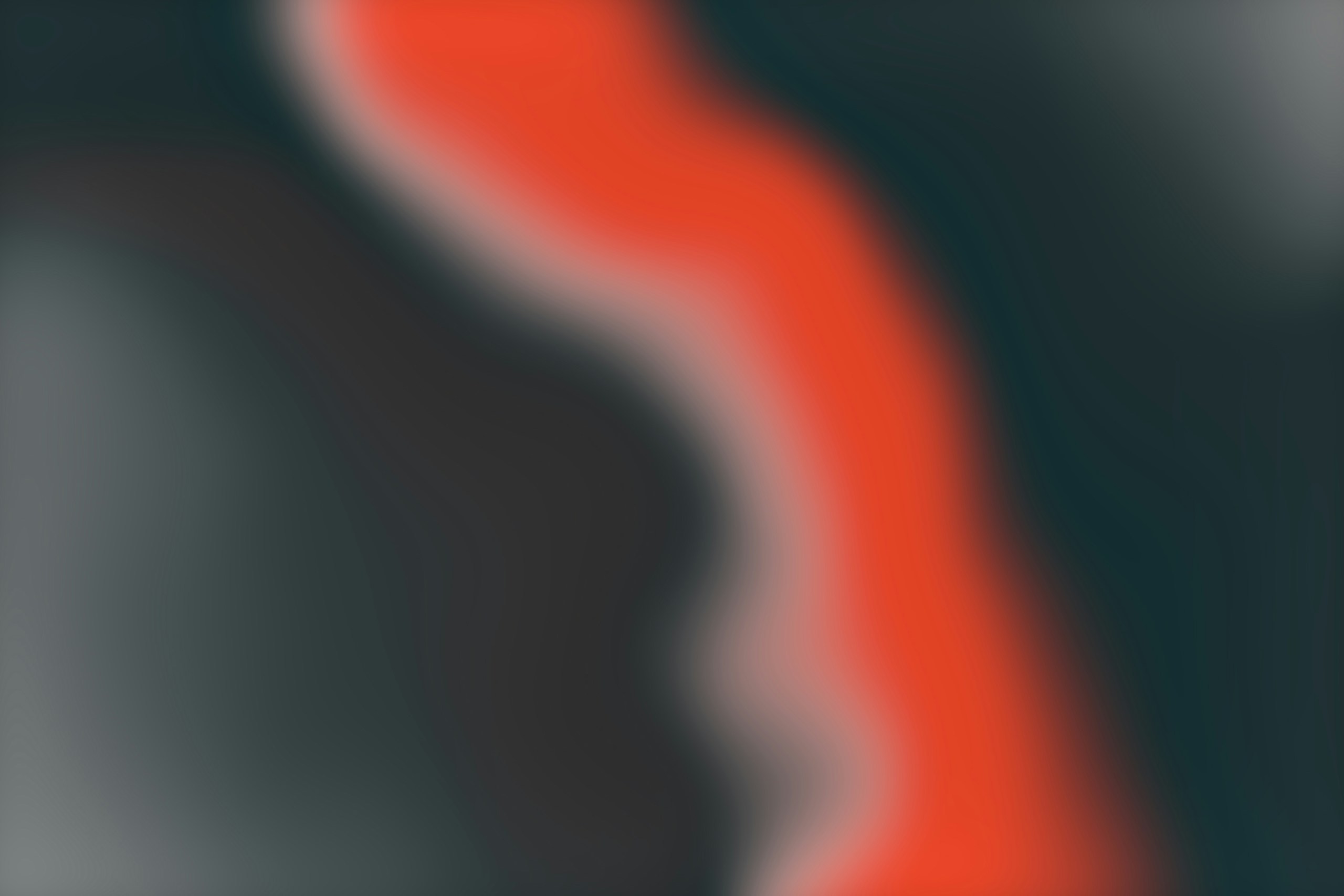 a blurry image of a red and black object
