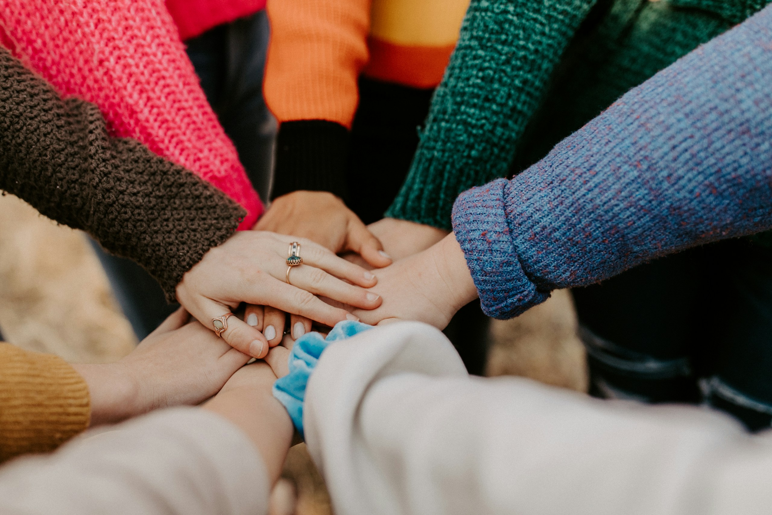 Women holding hands in unity like the women at the Stevens Point SDA church