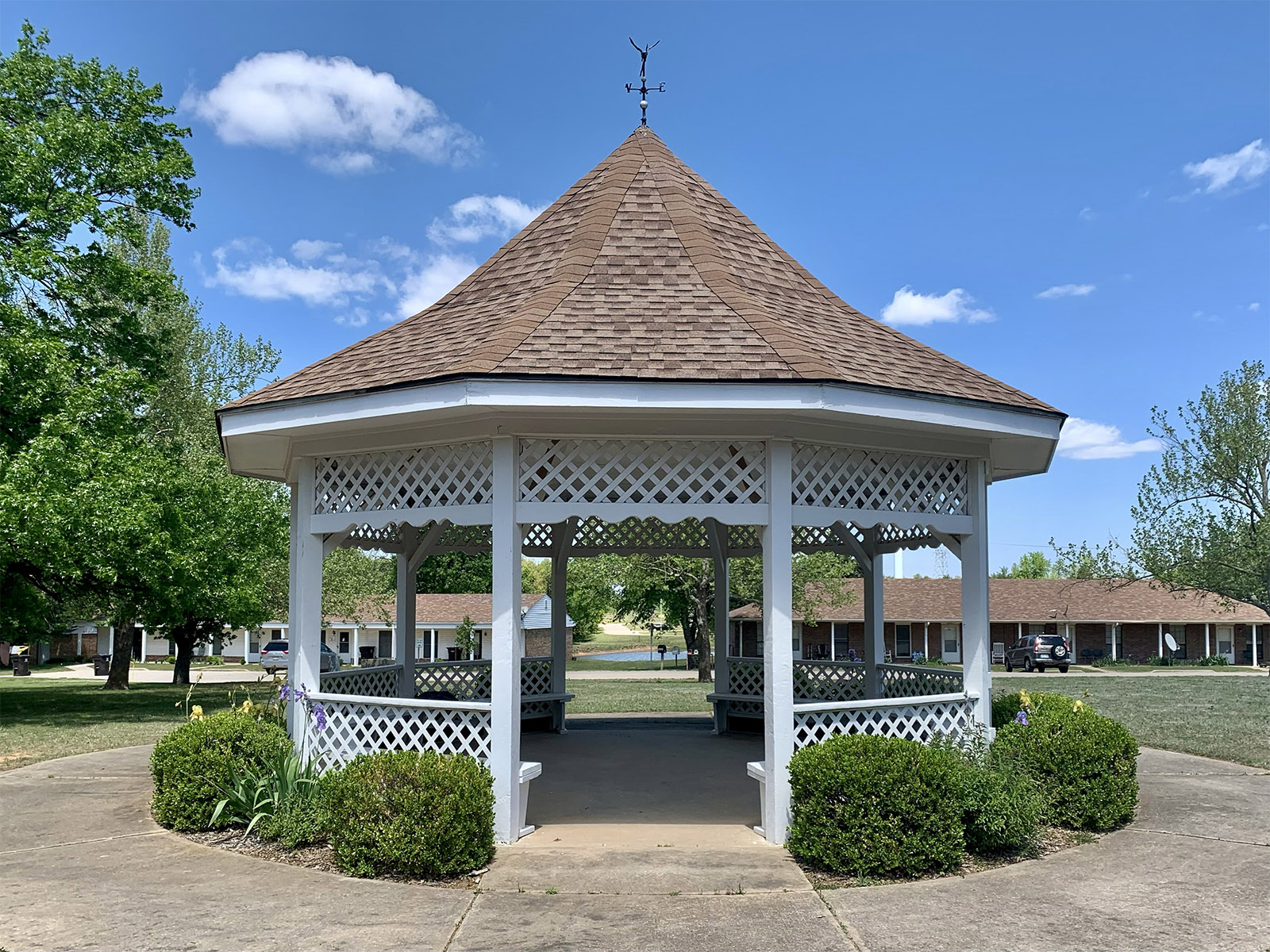Gazebo and surrounding residential buildings with landscaped green space at Summit Ridge Retirement community