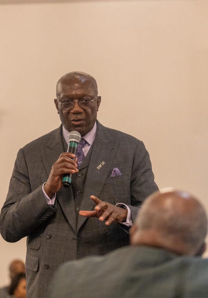 Image of a pastor with a microhpone.