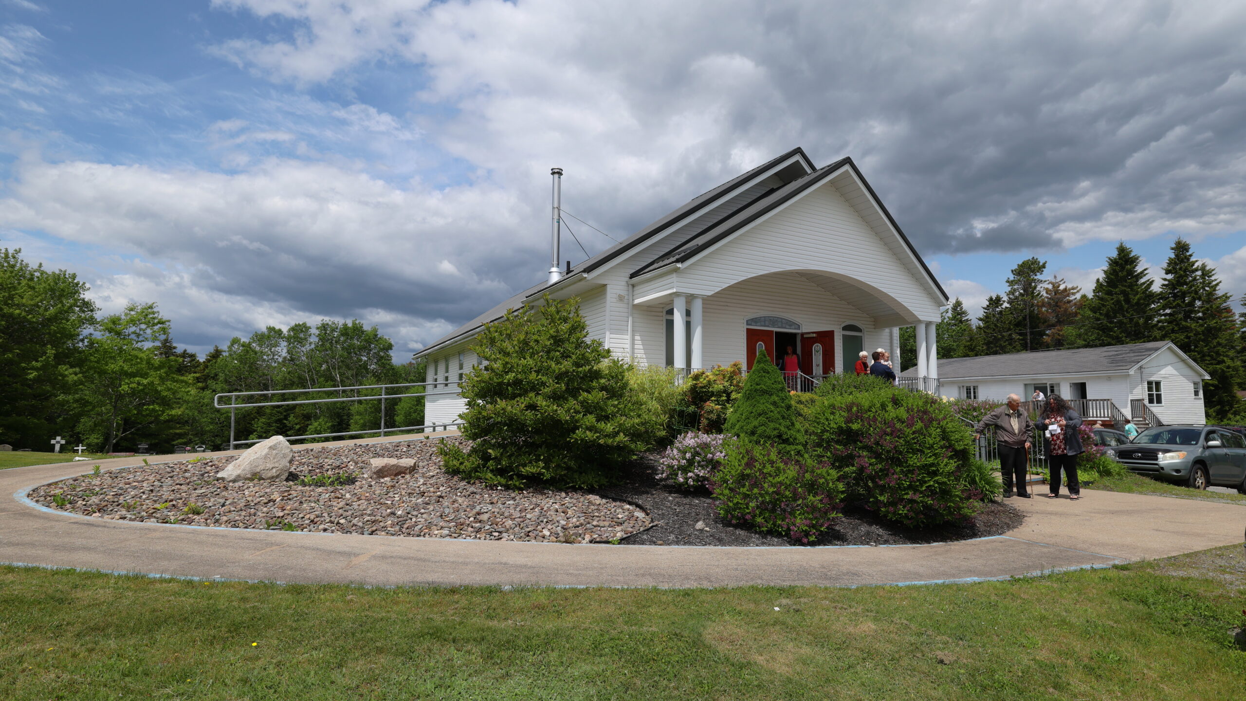 Photo of the church as people leave the building.