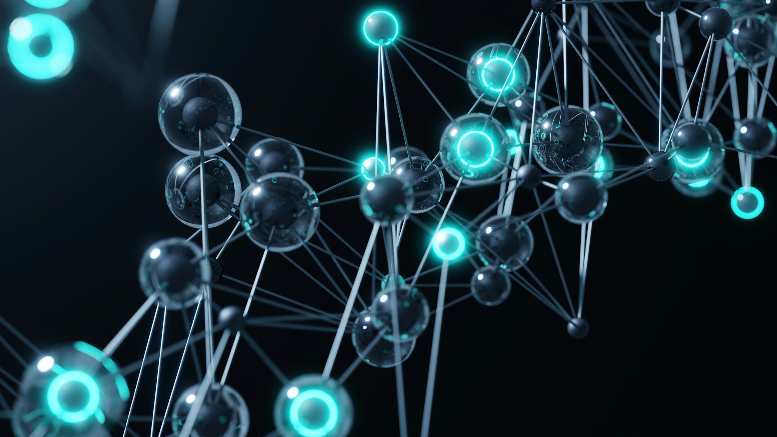 A group of blue and green balls on a black background