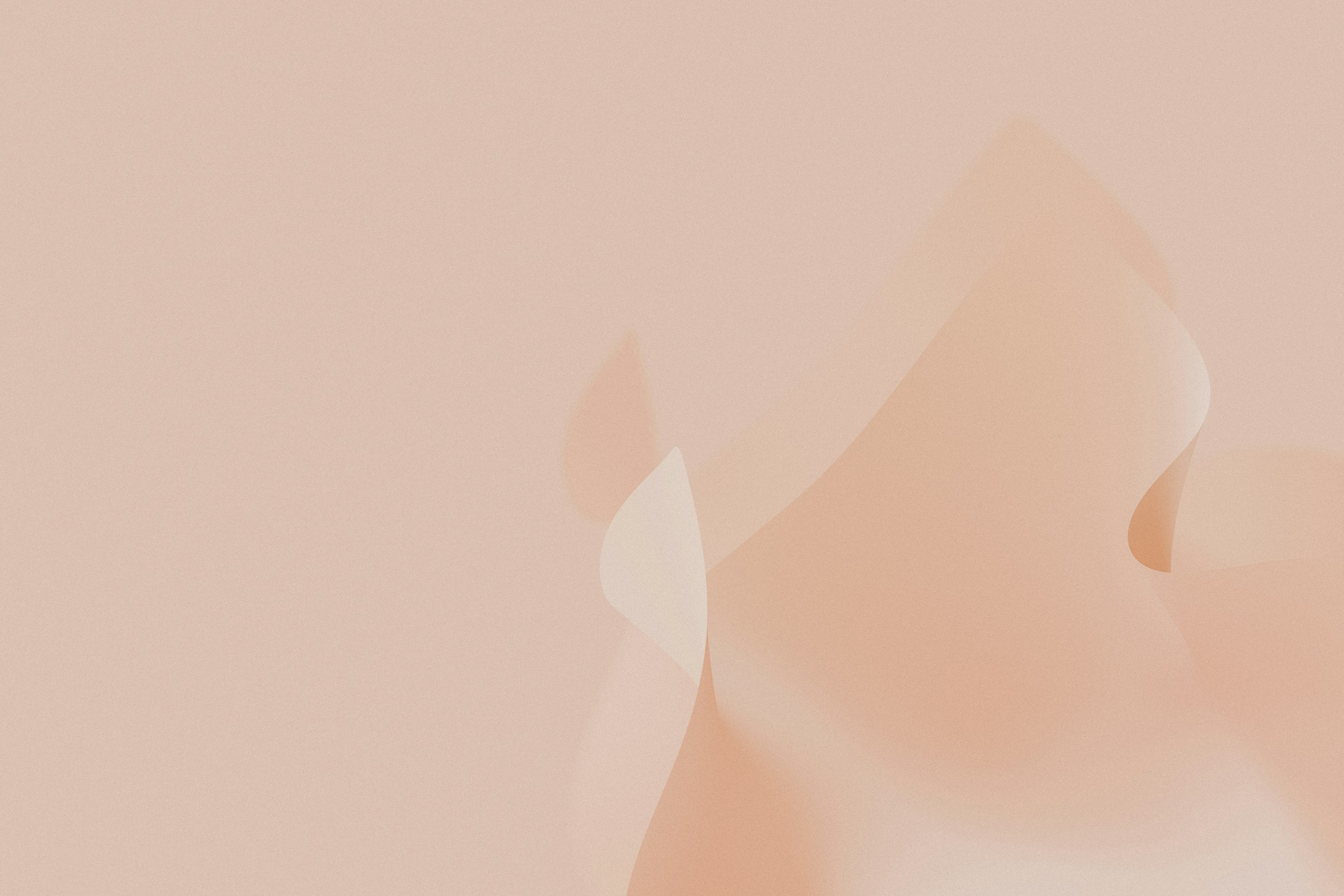 a pink background with a blurry pattern