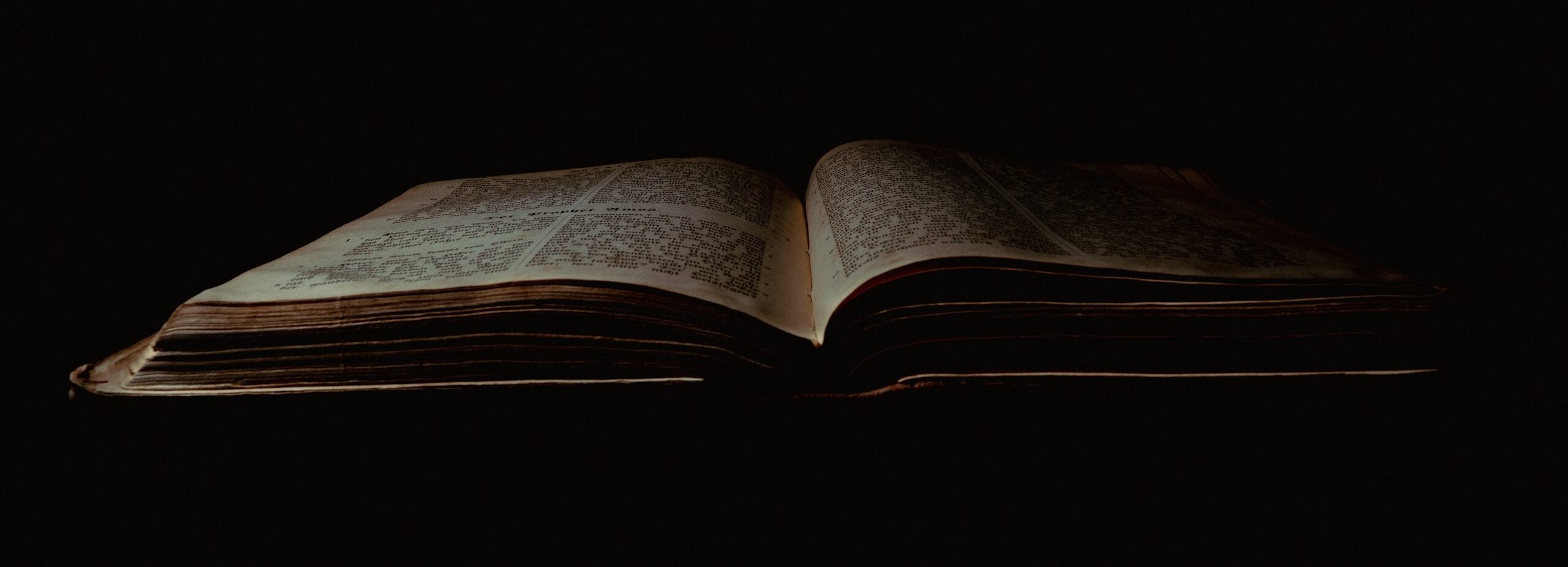 an open book sitting on top of a table