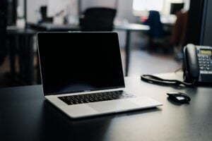 macbook pro on white table