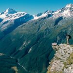 man standing on cliff