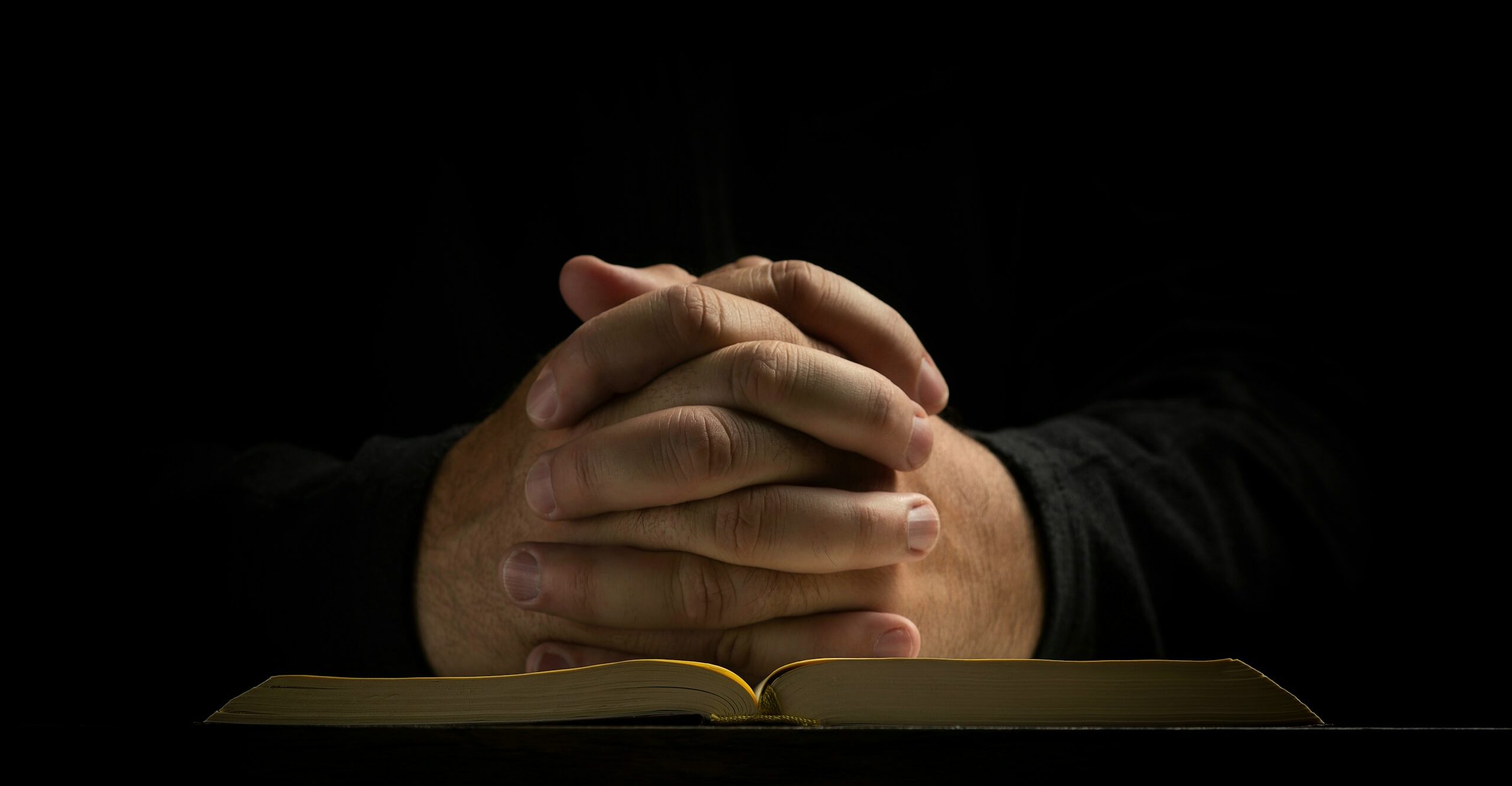 a person's hands on a book
