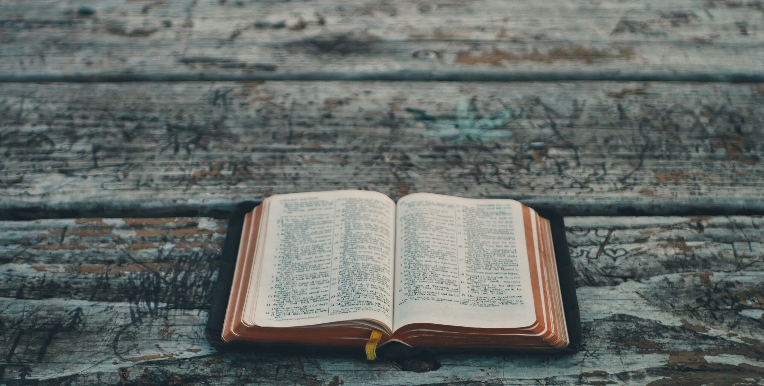 black book on gray wooden table